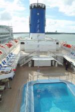 ID 3402 PACIFIC STAR (1981/35190grt/IMO 7915096, ex-COSTA TROPICALE, TROPICALE. Renamed OCEAN DREAM in 2008) -  A view aft from Verandah Deck (10) showing the Lido Deck Pool below. Scrapped 2021.